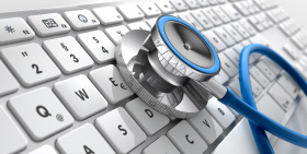 Stethoscope placed on a keyboard symbolizing the integration of healthcare imaging and technology.